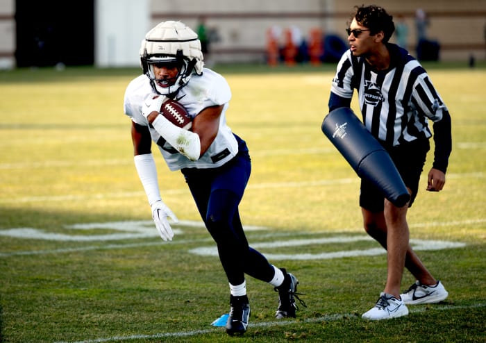 Penn State running back Quinton Martin runs a drill during Nittany Lions spring practice in State College.